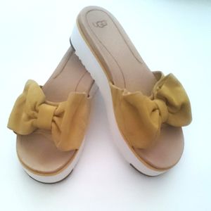 UGG Joan platform treadlite slide with mustard suede bow.